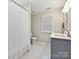 Bright bathroom with hexagon tile flooring, and double sink at 15715 Holyhead Ln, Huntersville, NC 28078