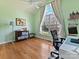 Light-filled bedroom with vaulted ceiling, hardwood floors and a large arched window at 15715 Holyhead Ln, Huntersville, NC 28078