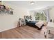 Comfortable bedroom with hardwood floors, and a well-lit, cozy atmosphere at 15715 Holyhead Ln, Huntersville, NC 28078