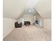 Spacious upstairs bonus room featuring carpeting and tv at 15715 Holyhead Ln, Huntersville, NC 28078