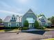 Community clubhouse with well-maintained landscaping and ample parking, creating a welcoming environment at 15715 Holyhead Ln, Huntersville, NC 28078