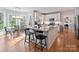 Modern kitchen with granite countertops, stainless steel appliances, and a breakfast bar at 15715 Holyhead Ln, Huntersville, NC 28078