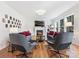 Inviting living room with fireplace, hardwood floors, and plenty of natural light for a comfortable atmosphere at 15715 Holyhead Ln, Huntersville, NC 28078