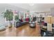Inviting living room featuring hardwood floors, large windows, and stylish furnishings at 15715 Holyhead Ln, Huntersville, NC 28078