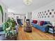 Open-concept living room featuring hardwood floors and comfortable seating arrangements at 15715 Holyhead Ln, Huntersville, NC 28078