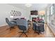 Cozy living room with fireplace, hardwood floors, and stylish decor, perfect for relaxing or entertaining at 15715 Holyhead Ln, Huntersville, NC 28078