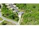 Aerial view showcases a spacious property with lush landscaping, neighboring homes, and road access at 158 Country Lake Dr, Mooresville, NC 28115