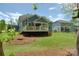 Backyard features a spacious deck, mature trees, and well-maintained lawn, ideal for outdoor enjoyment at 158 Country Lake Dr, Mooresville, NC 28115