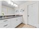 Well-lit bathroom boasts granite countertops, white cabinetry, and wood-look tile flooring at 158 Country Lake Dr, Mooresville, NC 28115