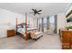 Comfortable bedroom with a four-poster bed, ceiling fan, neutral carpet, and double windows at 158 Country Lake Dr, Mooresville, NC 28115