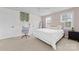 Comfortable bedroom with a vanity desk, plush bedding, and ample natural light at 158 Country Lake Dr, Mooresville, NC 28115