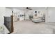 Large bonus room with neutral carpeting, ceiling fan, lots of windows and white storage units at 158 Country Lake Dr, Mooresville, NC 28115
