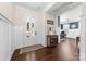 Elegant foyer with hardwood floors, a decorative table, and paneled walls at 158 Country Lake Dr, Mooresville, NC 28115