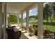 Front porch with columns, outdoor furniture, and view of landscaped front yard at 158 Country Lake Dr, Mooresville, NC 28115