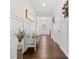 Hallway with hardwood flooring, a bench, decorative lighting, and wainscoting at 158 Country Lake Dr, Mooresville, NC 28115