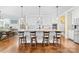 Bright open kitchen with an oversized island with counter seating and stainless steel appliances at 158 Country Lake Dr, Mooresville, NC 28115