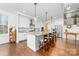 Spacious kitchen with an oversized island, breakfast bar, stainless appliances, and white cabinets at 158 Country Lake Dr, Mooresville, NC 28115