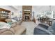Cozy living room featuring a stone fireplace, comfortable seating, and bright, open layout at 158 Country Lake Dr, Mooresville, NC 28115