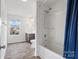 Bright bathroom with a shower-tub combination and a window at 18607 Mainsail Ct, Lancaster, SC 29720