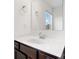 Modern bathroom with dark wood cabinets and white countertops at 18607 Mainsail Ct, Lancaster, SC 29720