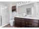 Bathroom featuring dual sinks, a large mirror, and a shower with a glass door at 18607 Mainsail Ct, Lancaster, SC 29720