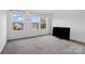 Bedroom featuring large windows offering backyard views and a television at 18607 Mainsail Ct, Lancaster, SC 29720
