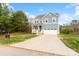 Charming two-story home with a well-manicured lawn and attached garage at 18607 Mainsail Ct, Lancaster, SC 29720