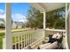 Comfortable seating on the porch with a view of the neighborhood at 18607 Mainsail Ct, Lancaster, SC 29720