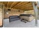 Covered outdoor seating area featuring a hot tub with steps and a comfortable couch at 18607 Mainsail Ct, Lancaster, SC 29720