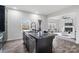Open concept kitchen featuring granite island, stainless steel appliances, and an open view to the living room at 18607 Mainsail Ct, Lancaster, SC 29720