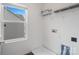 Clean and bright laundry room with a window offering plenty of natural light at 18607 Mainsail Ct, Lancaster, SC 29720