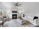 Bright living room featuring a fireplace, modern decor, neutral colors, and recessed lighting at 18607 Mainsail Ct, Lancaster, SC 29720