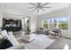 Open-concept living area with natural light, neutral color palette, and view into the kitchen at 18607 Mainsail Ct, Lancaster, SC 29720