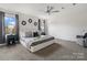 Relaxing main bedroom features neutral tones, decorative mirrors, side tables with lamps, and large windows at 18607 Mainsail Ct, Lancaster, SC 29720