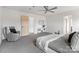 Spacious main bedroom featuring a ceiling fan, sitting area, and adjacent bathroom entrance at 18607 Mainsail Ct, Lancaster, SC 29720