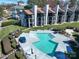 Upscale condos with private balconies surround a community pool with ample space for relaxation and recreation at 18877 Vineyard Point Ln, Cornelius, NC 28031