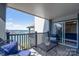 This outdoor balcony provides exceptional lake views and is just steps from the main bedroom at 18877 Vineyard Point Ln, Cornelius, NC 28031