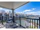 Enjoy a relaxing moment from this outdoor balcony with views of the pool, lake, and boat docks at 18877 Vineyard Point Ln, Cornelius, NC 28031