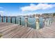 Scenic view from a wooden dock with boats gently bobbing in the harbor, offering a peaceful waterfront experience at 18877 Vineyard Point Ln, Cornelius, NC 28031