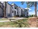 Exterior view of modern townhomes and grassy landscaped area at 18877 Vineyard Point Ln, Cornelius, NC 28031