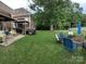 Spacious backyard featuring a patio, fire pit area and mature trees at 205 Kaitlyn Ln, Kings Mountain, NC 28086