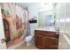 Charming bathroom featuring a shower with a scenic shower curtain and wood vanity at 205 Kaitlyn Ln, Kings Mountain, NC 28086