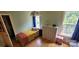 Cozy bedroom showcasing natural light, hardwood floors, and a comfortable twin bed at 205 Kaitlyn Ln, Kings Mountain, NC 28086
