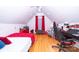 Cozy bedroom with wood floors, sloped ceilings, and unique architectural details at 205 Kaitlyn Ln, Kings Mountain, NC 28086