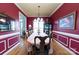 Formal dining room with hardwood floors, elegant chandelier, and traditional decor, perfect for entertaining at 205 Kaitlyn Ln, Kings Mountain, NC 28086