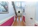 Bright and airy foyer with hardwood floors, staircase and white trim, leading to the front door at 205 Kaitlyn Ln, Kings Mountain, NC 28086