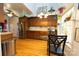 Bright eat-in kitchen with stainless steel appliances, wood cabinets, and a glass table by the window at 205 Kaitlyn Ln, Kings Mountain, NC 28086