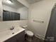 Updated bathroom boasts stylish vanity, modern fixtures, and shower with tub combination at 216 W Shannonhouse St, Shelby, NC 28152