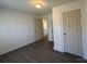 Bedroom with fresh paint and modern flooring features neutral colors and ample closet space at 216 W Shannonhouse St, Shelby, NC 28152