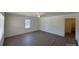 Bright bedroom with wood-look floors, neutral walls, and a ceiling fan for added comfort at 216 W Shannonhouse St, Shelby, NC 28152